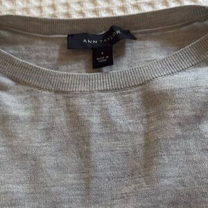 Ann Taylor light gray long sleeve lightweight sweater with drawstring detail.